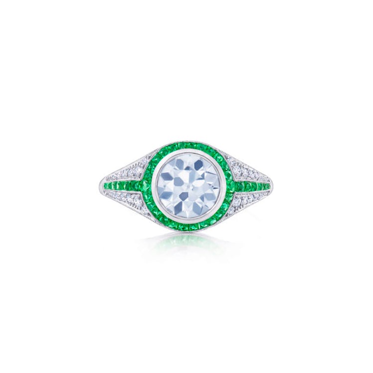 Round Diamond Engagement Ring with a Pave Diamond and Emerald Calibre