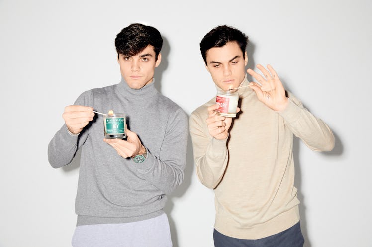 Ethan and Grayson Dolan hold their winter collection candles from Wakeheart.