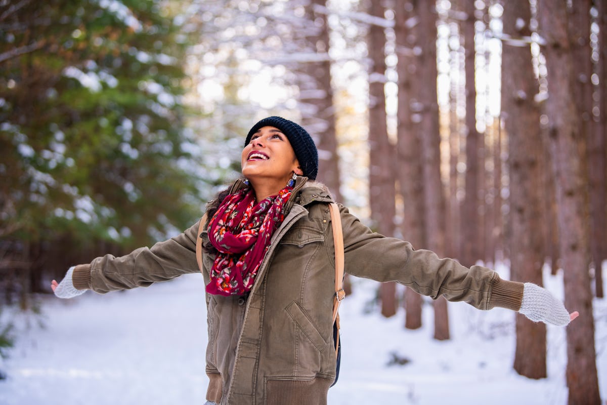 Woman looking up at snow