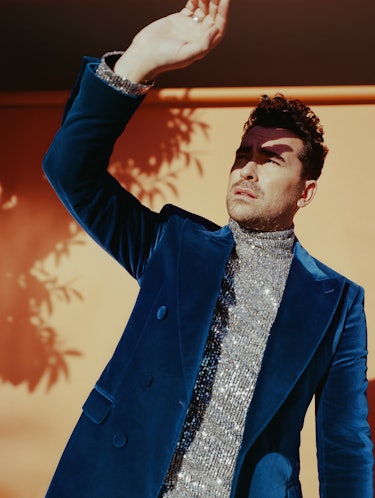 The Canadian wearing a ring a blue Etro jacket with a shiny  AMI Paris turtleneck underneath