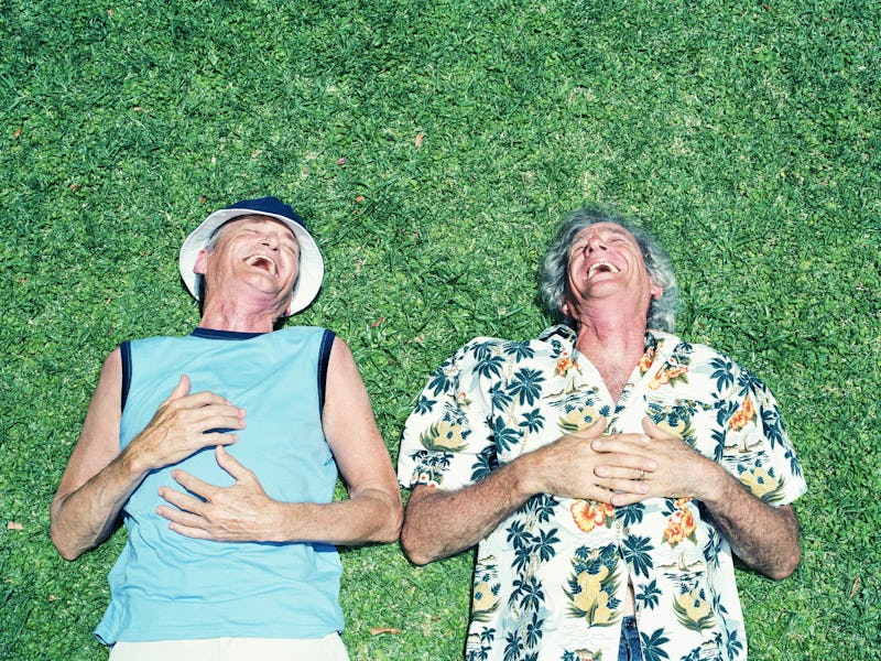 Two people laughing.