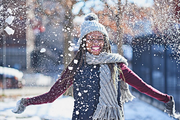 Woman playing in snow