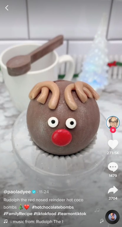 A Rudolph hot chocolate bomb from TikTok sits on a kitchen counter. 