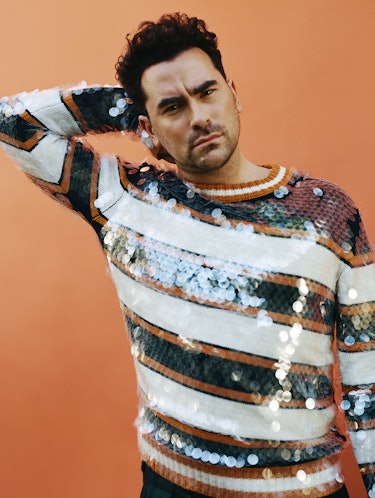 Dan Levy in a sequin-based white, brown, and black Lanvin sweater
