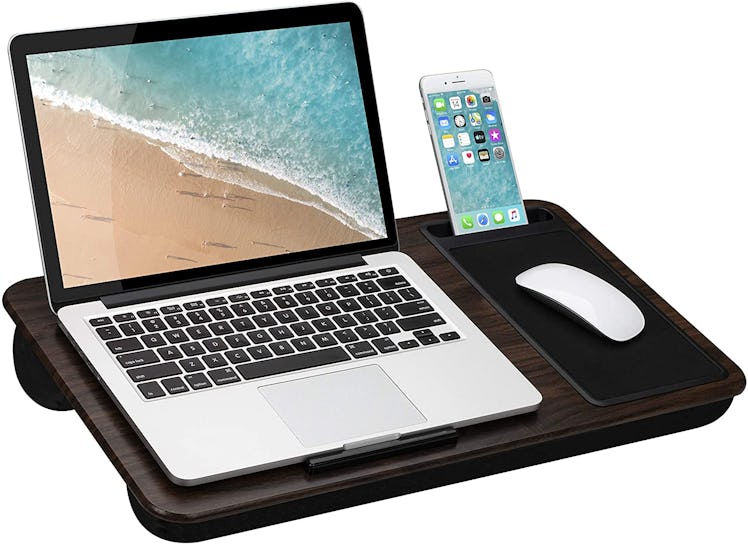 If you're shopping for laptop accessories, consider this wooden lap desk with a padded design that m...