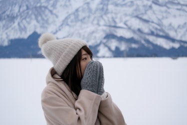 Young woman wearing mittens