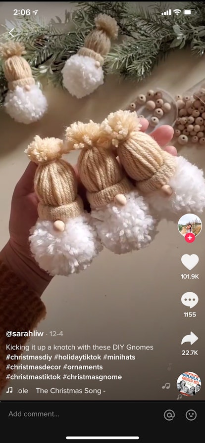 A TikTok crafter uses a paper towel roll and yarn to create adorable Christmas gnomes in a thriftmas...