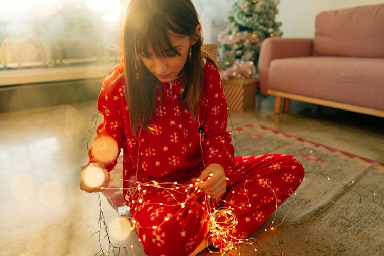 Young woman in Christmas onesie