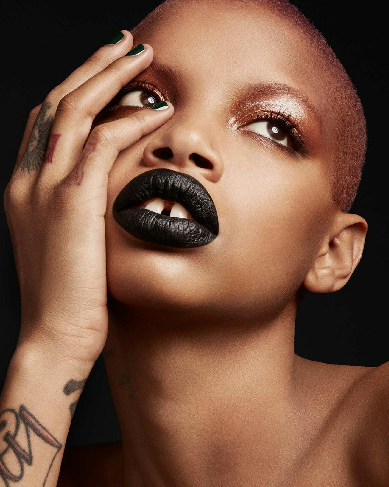 Slick Woods wears dark black Fenty Beauty lipstick