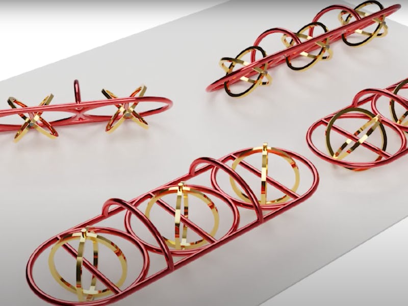 Red and gold plastic and metallic chains are shown in the photo. These chains are microbots that can...