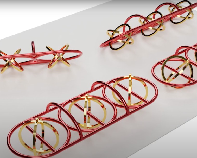 Red and gold plastic and metallic chains are shown in the photo. These chains are microbots that can...