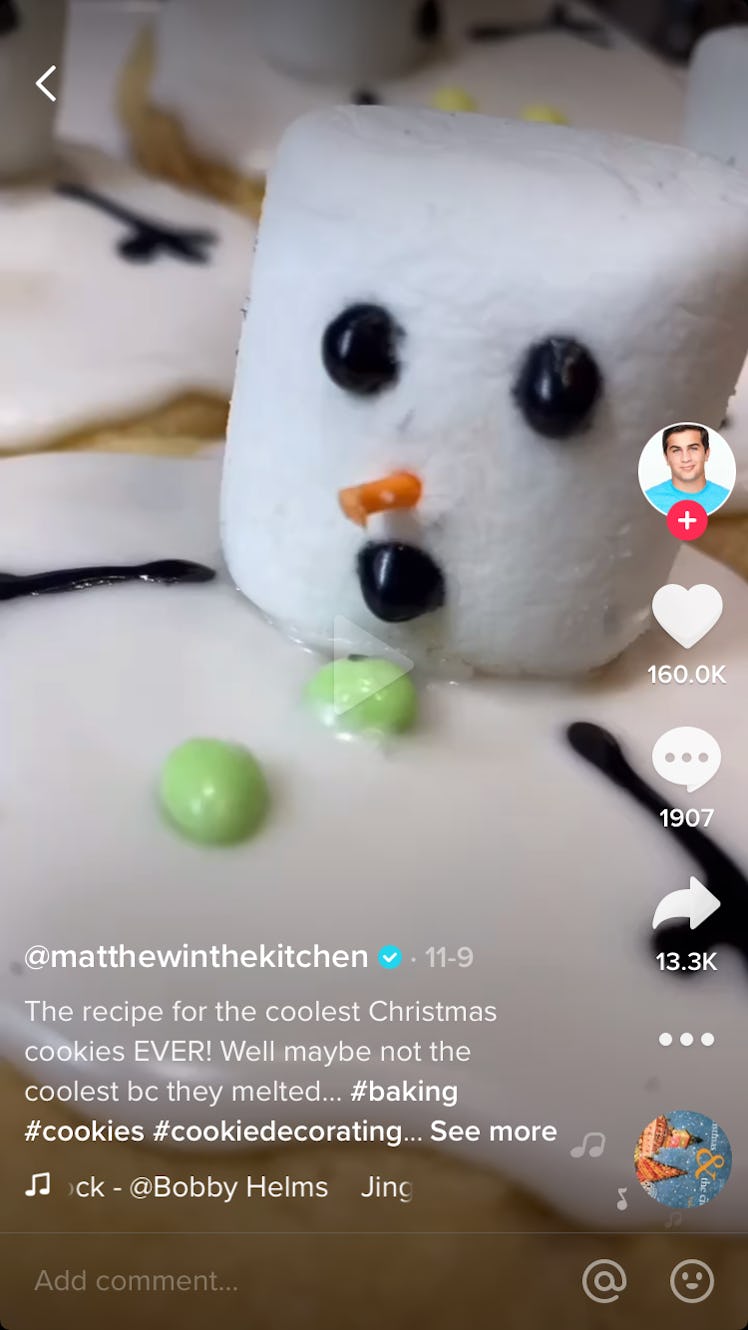 A man shows how to make snowman cookies on TikTok in a baking video.