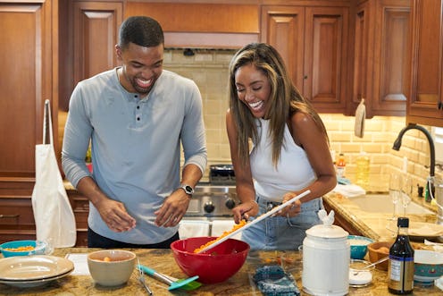 Ivan Hall and Tayshia Adams cook together during his 'Bachelorette' hometown date  via ABC Press Sit...