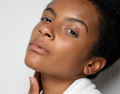 A woman with dry skin in the winter, posing with her head slightly leaned back