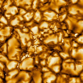The image shows a pattern of turbulent, “boiling” gas that covers the entire sun.