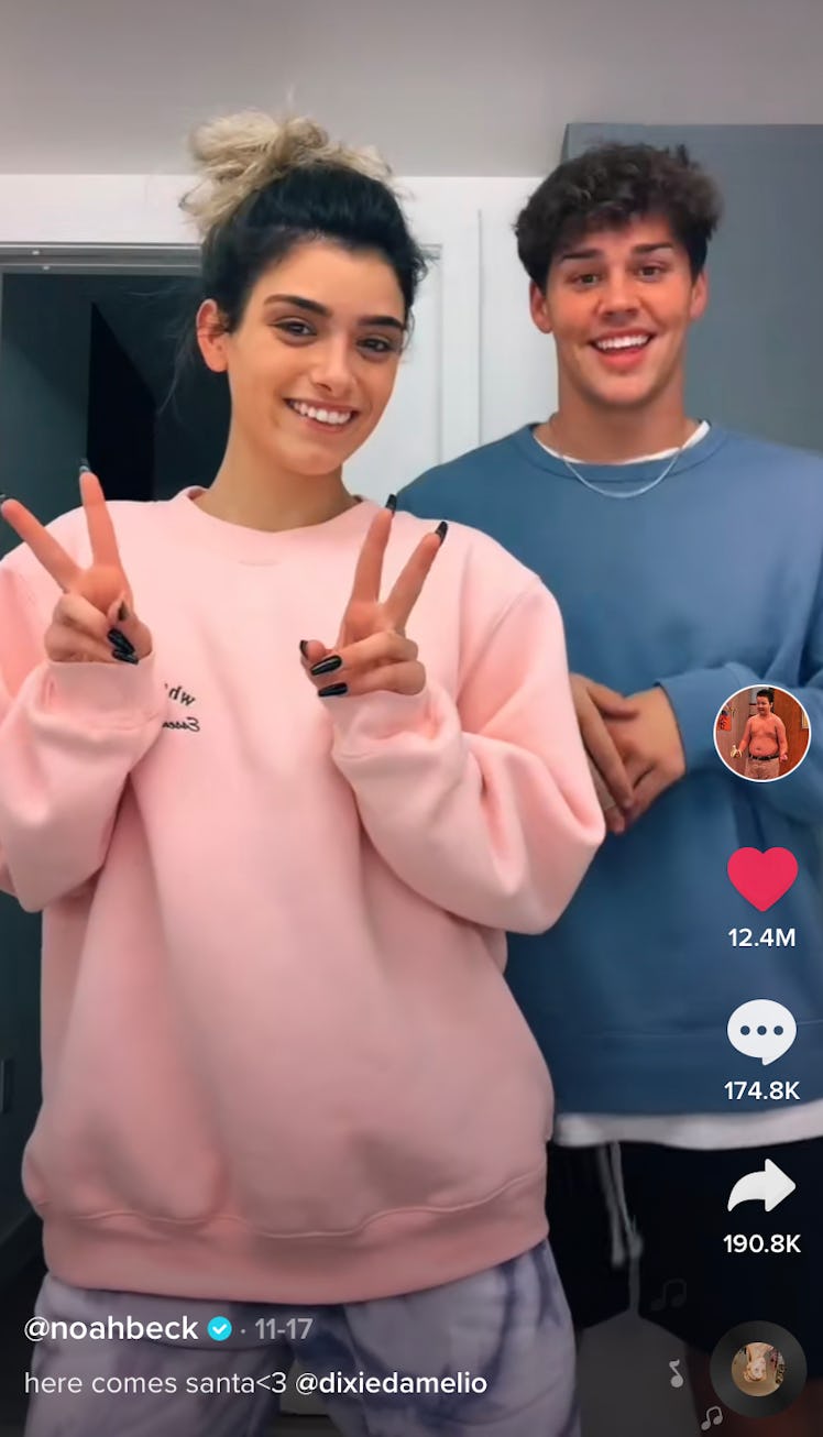 Dixie D'Amelio and Noah Beck dance to "Here Comes Santa Claus" on TikTok.