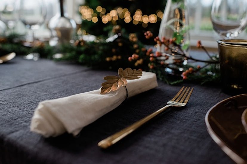 closeup of table setting at christmas dinner table