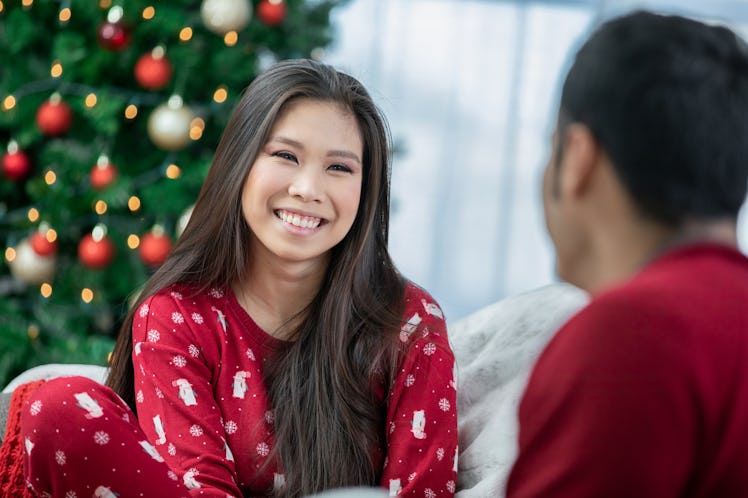 Young woman in holiday onesie