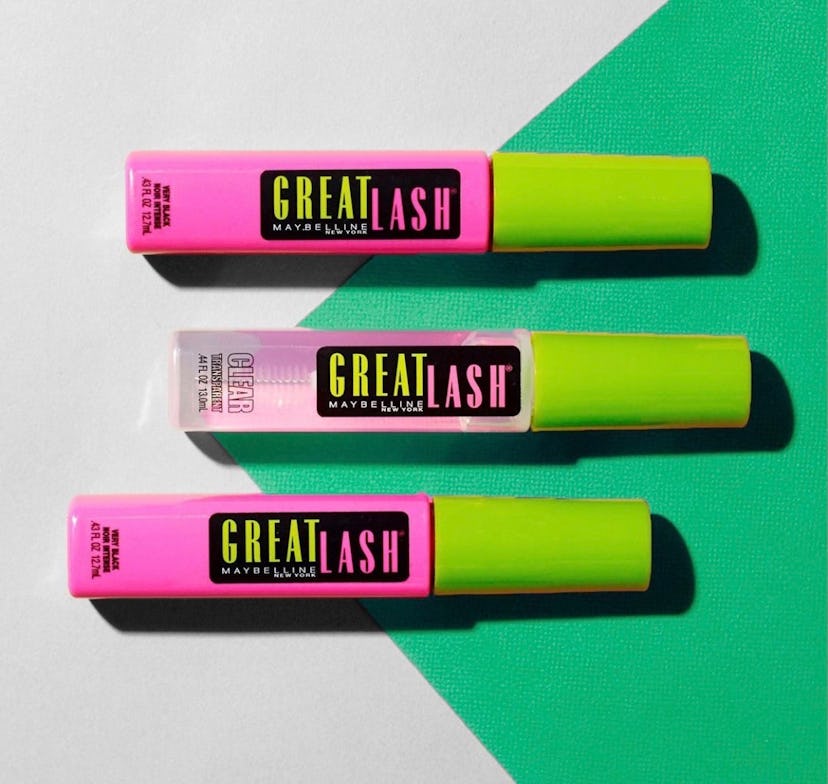 three tubes of Maybelline Great Lash lying next to each other on a white and green background