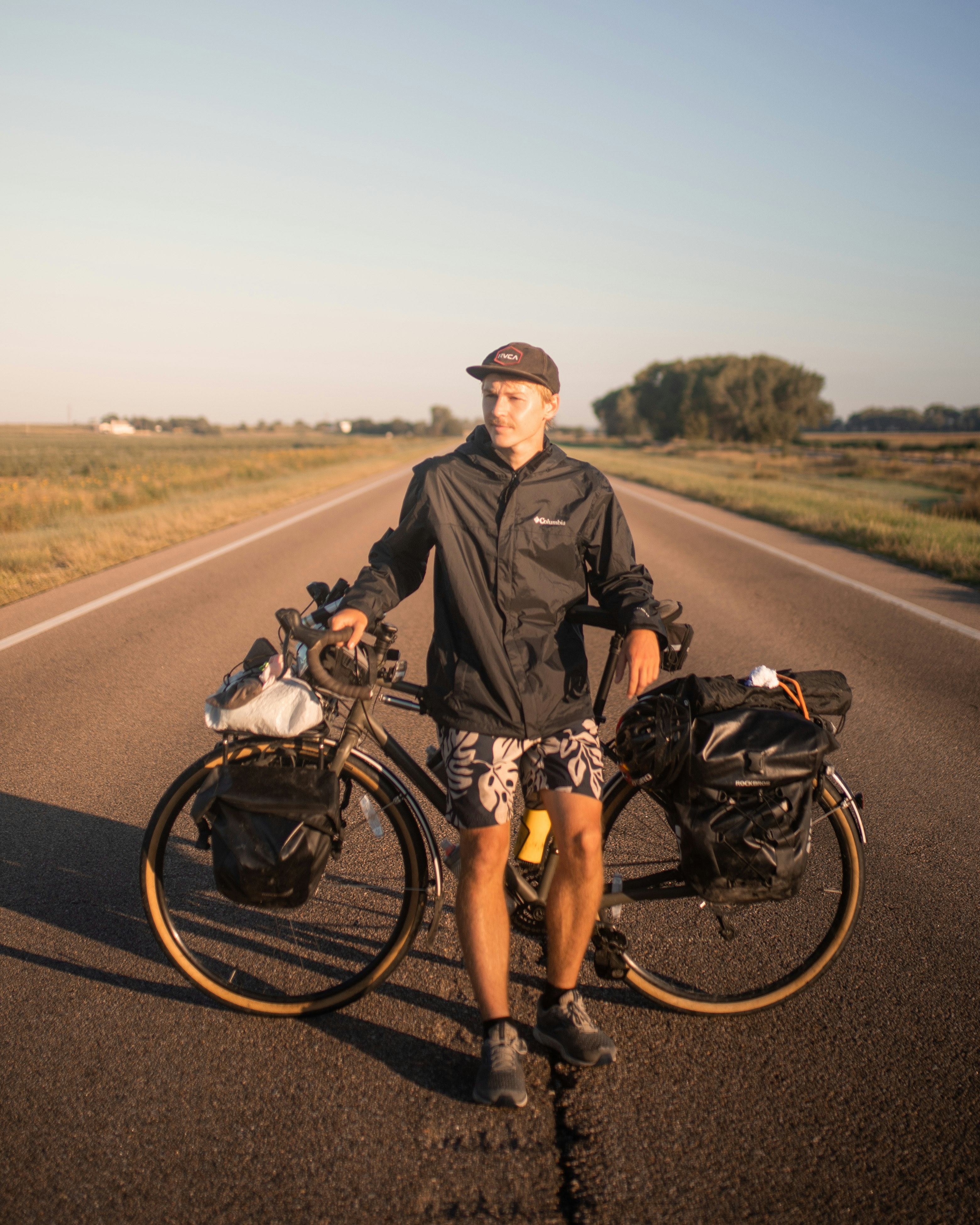 Chris Hytha leaning against a bicycle
