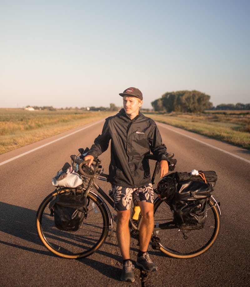 Chris Hytha leaning against a bicycle