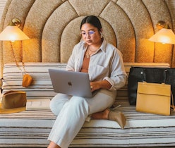 A woman using her laptop in a Los Angeles hotel