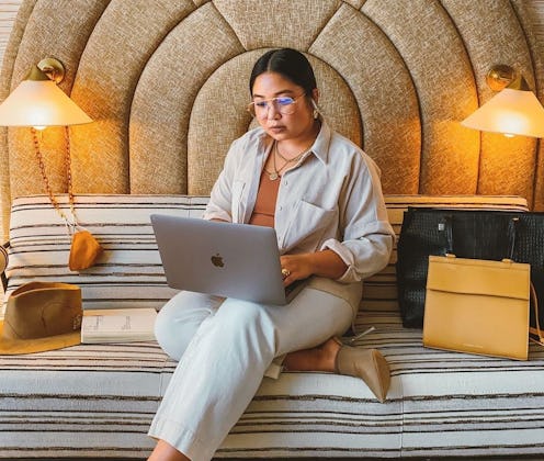 A woman using her laptop in a Los Angeles hotel