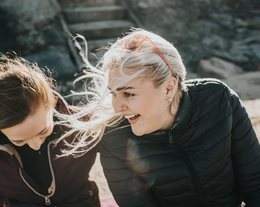 two women sitting and having a conversation