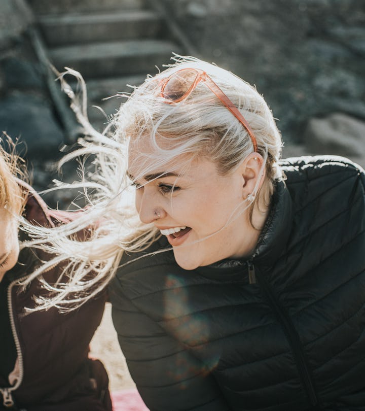 two women sitting and having a conversation 