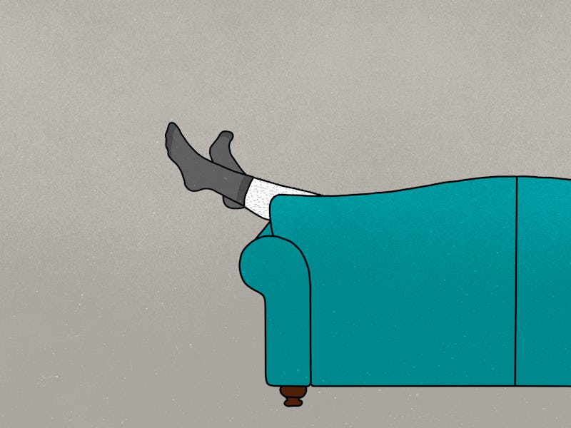 Legs dangling from couch.