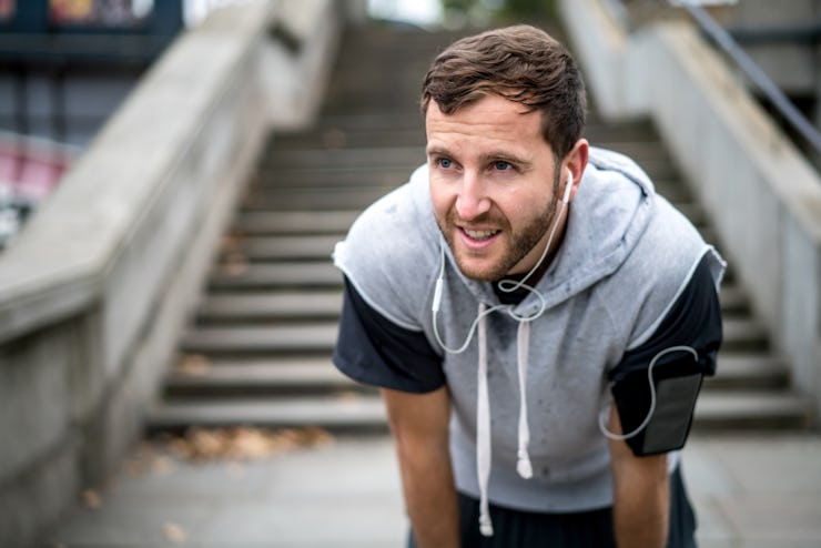 Man taking a break while on a run.