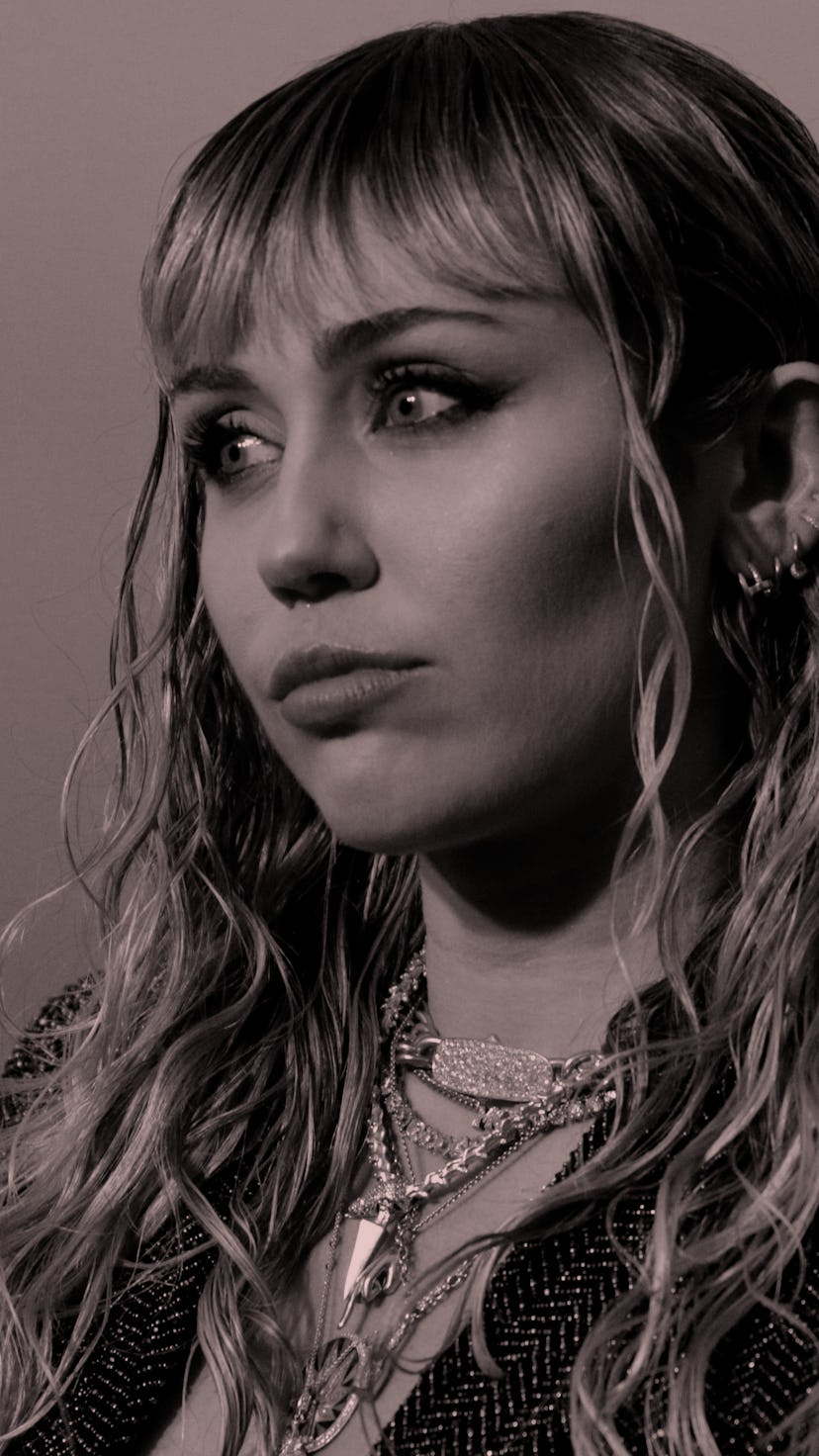 Miley Cyrus with blue eyeliner and long blonde hair