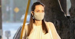 Angelina Jolie wearing a white face mask