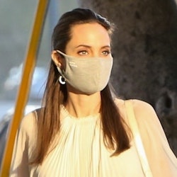 Angelina Jolie wearing a white face mask