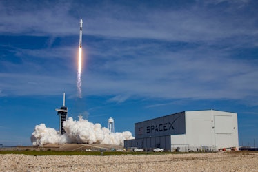 Zooming off in front of the SpaceX logo.