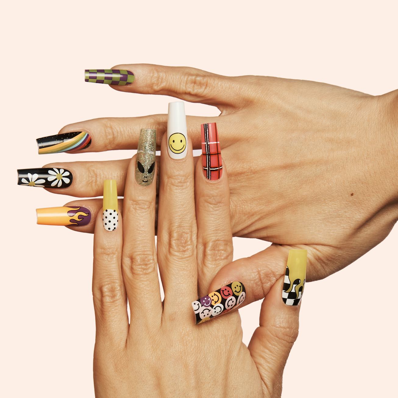 One hand lays atop another, showing off nails from the Nails By Mei and ManiMe nail sticker collecti...