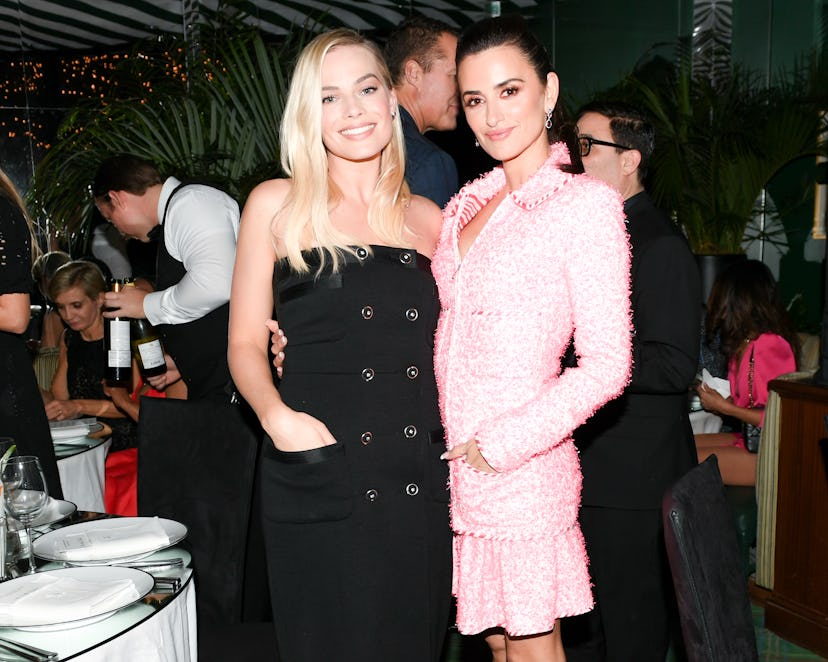 Margot Robbie and Penélope Cruz posing for a photo at Chanel's Intimate Pre-Oscars Party