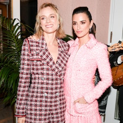 Diane Kruger and Penélope Cruz posing for a photo at Chanel's Intimate Pre-Oscars Party