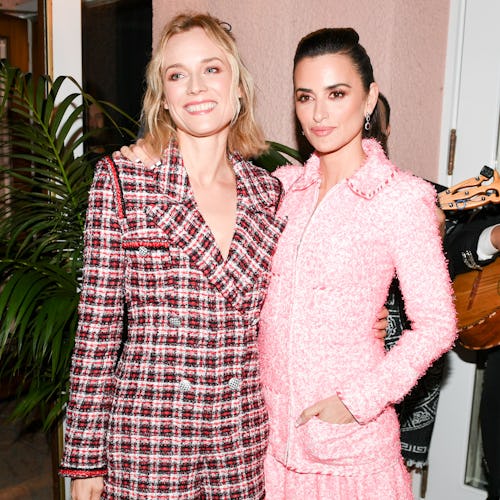 Diane Kruger and Penélope Cruz posing for a photo at Chanel's Intimate Pre-Oscars Party