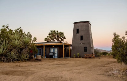 A tower in Joshua Tree is part of a cabin home listed on Airbnb. 