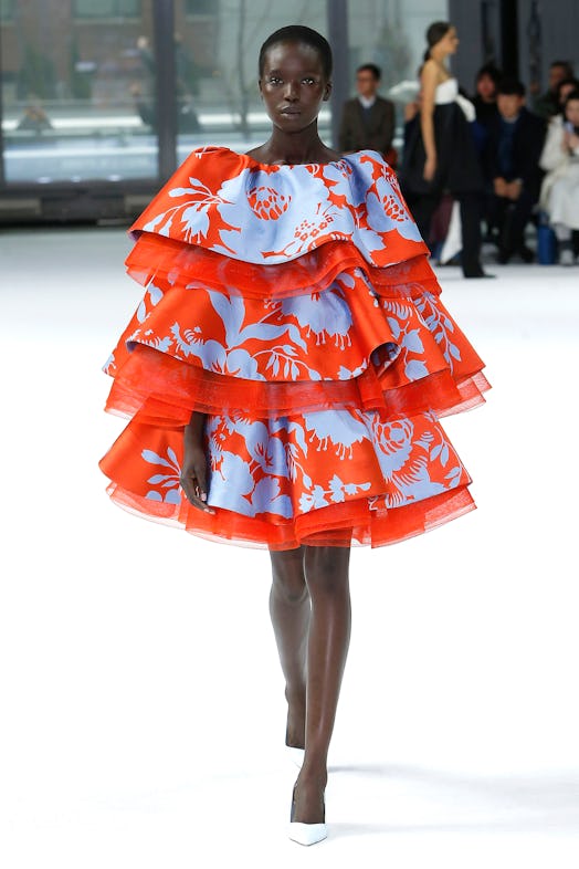 A model wearing all-engulfing ruffled dress with a floral pattern from Carolina Herrera Fall/Winter ...