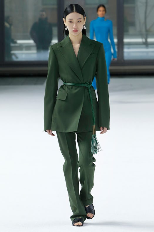 A model wearing an olive-green suit from Carolina Herrera Fall/Winter 2020 collection.