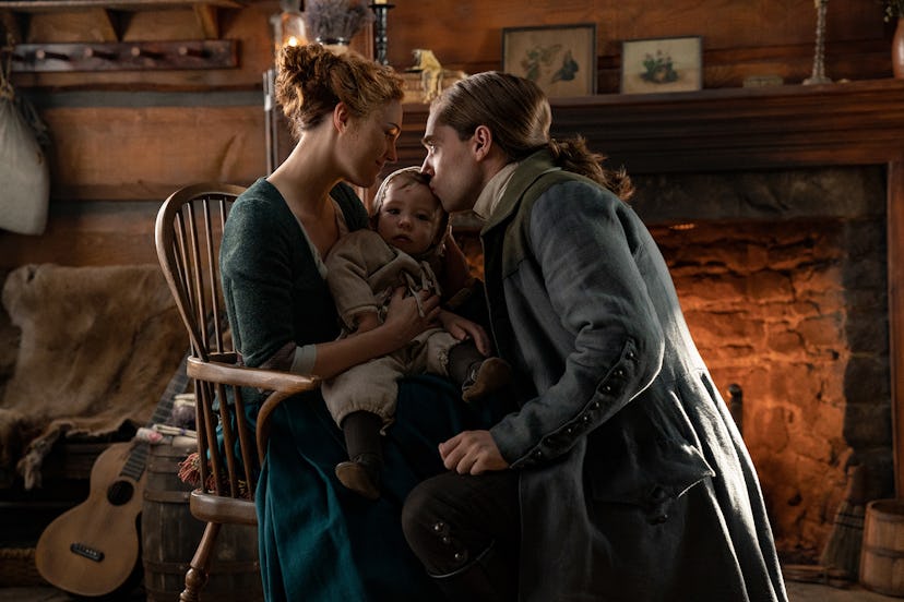 Sophie Skelton as Brianna "Bree" Randall, Richard Rankin as Roger Wakefield, and their son Jeremiah ...