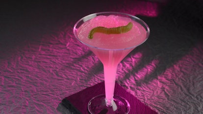 A pink mocktail inspired by Hades from 'Hercules' sits on a table at Disney for the Disney Villains ...