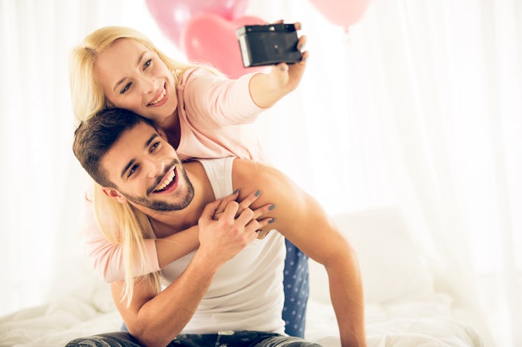 Young couple taking selfie on Valentine's Day