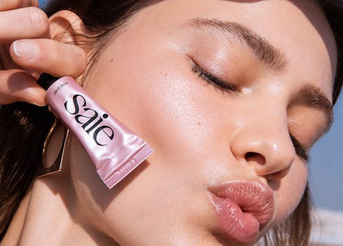 Saie's new Dew Balm in "Rosy Gold" on model.