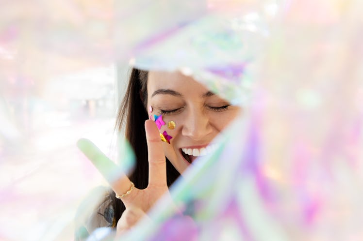 Young woman holding up peace sign