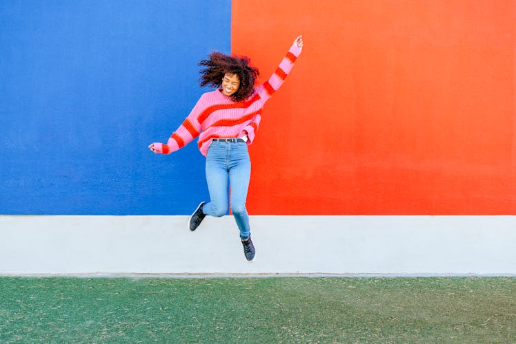 Young woman leaping for Leap Year 2020