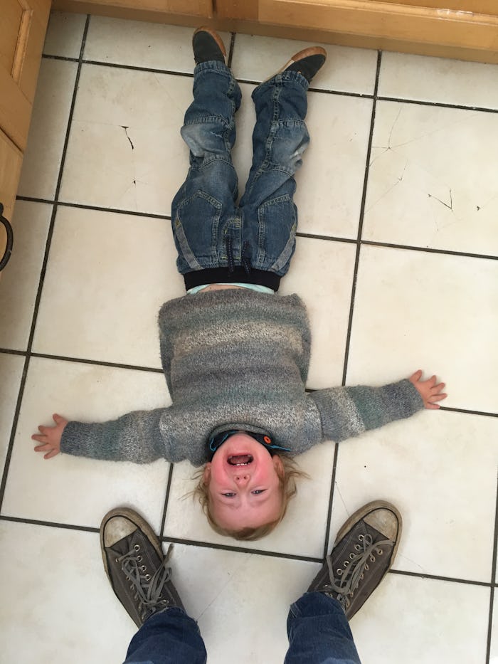 toddler throws a tantrum on floor