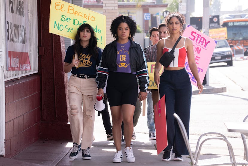 Yessika and Ana's friends stage a protest outside Mama Fina's.